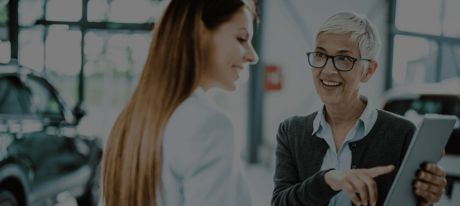 women in car dealership