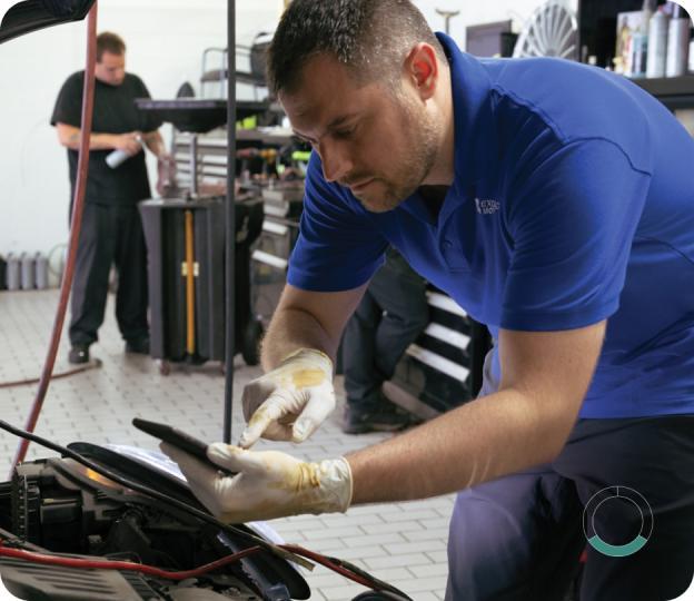 Technician working on a car